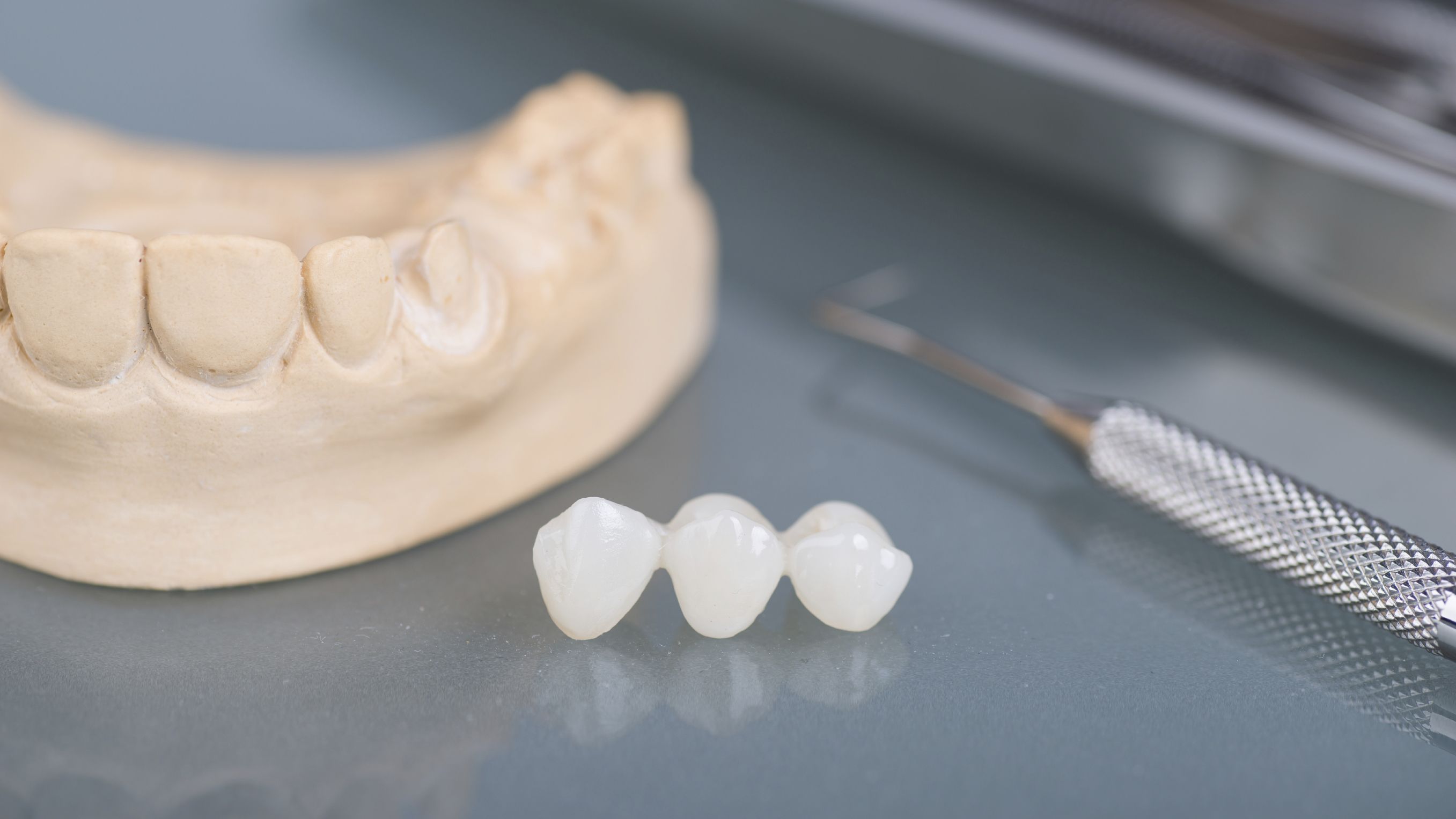Photo of a dental bridge and mold