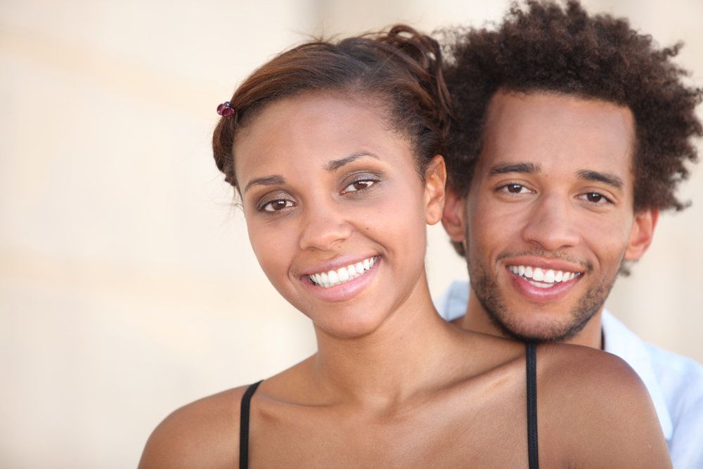Smiling couple posing for picture